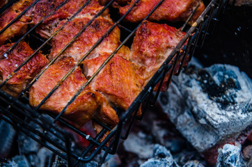 barbecue is prepared on the grill. Smoke from the fire