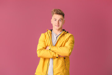 Young man on color background