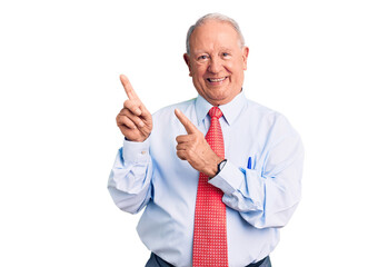 Senior handsome grey-haired man wearing elegant tie and shirt smiling and looking at the camera pointing with two hands and fingers to the side.