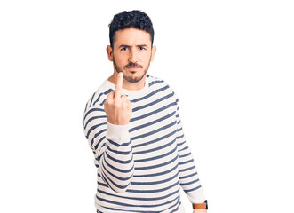 Young hispanic man wearing casual clothes showing middle finger, impolite and rude fuck off...