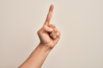 Hand of caucasian young man showing fingers over isolated white background counting number one using index finger, showing idea and understanding