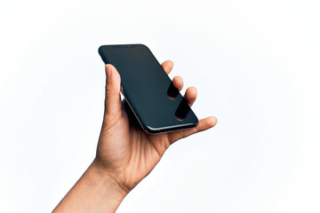 Hand of caucasian young man holding smartphone showing screen over isolated white background