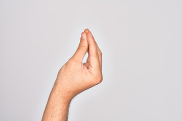 Hand of caucasian young man showing fingers over isolated white background doing Italian gesture...