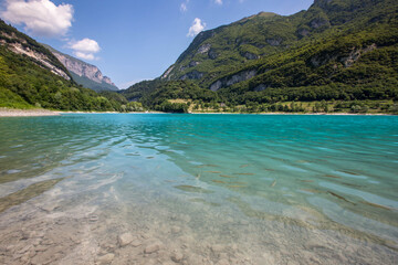 Obraz premium Panorama of Lake Tenno surrounded by Italian mountains with turqoise water