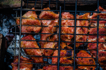 barbecue is prepared on the grill. Smoke from the fire