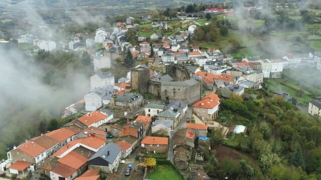 Castro Caldelas. Village of Galicia with fog. Spain. Aerial Drone Footage