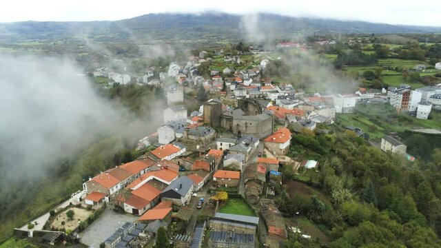 Castro Caldelas. Village of Galicia with fog. Spain. Aerial Drone Footage