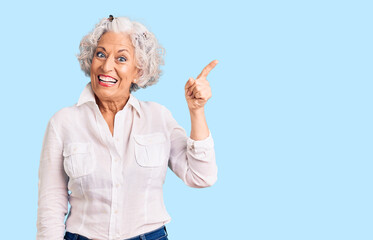 Senior grey-haired woman wearing casual clothes pointing finger up with successful idea. exited and happy. number one.