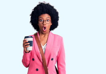Young african american woman wearing leather bag and drinking a take away cup of coffee scared and amazed with open mouth for surprise, disbelief face