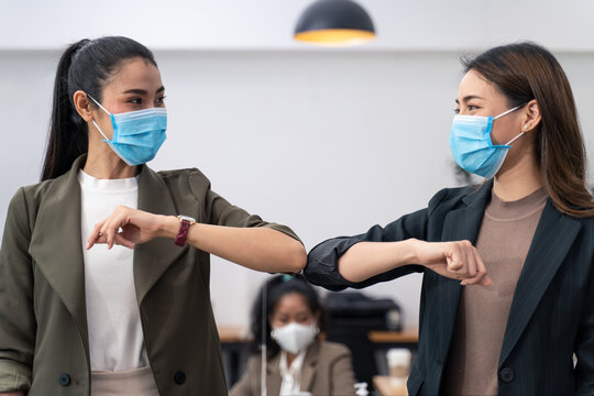 People in office company have elbow greeting during covid pandemic