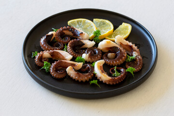 Grilled octopus with lemon and parsley