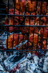 barbecue is prepared on the grill. Smoke from the fire