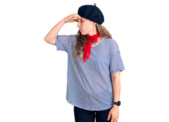 Young beautiful blonde woman wearing french beret and striped t-shirt tired rubbing nose and eyes feeling fatigue and headache. stress and frustration concept.