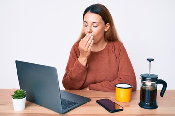 Young brunette woman working at the office drinking a cup of coffee feeling unwell and coughing as symptom for cold or bronchitis. health care concept. - obrazy, fototapety, plakaty