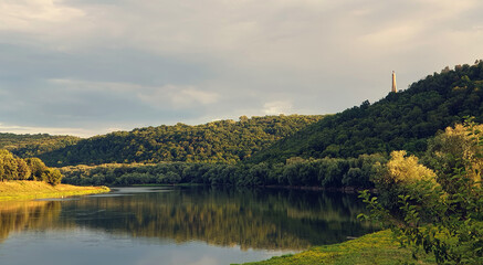 Panoramic view on river Dniester and monument Lumanarea Recunostintei  in the Soroca town on summer, Moldova, the north-eastern part of the country. Picturesque landscape.
