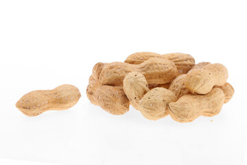 Peanuts stack in husk one broken with two seeds inside isolated on white background