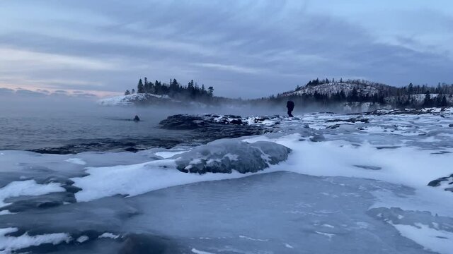 winter time at split rock lighthouse state park in minnesota, lake superior frozen