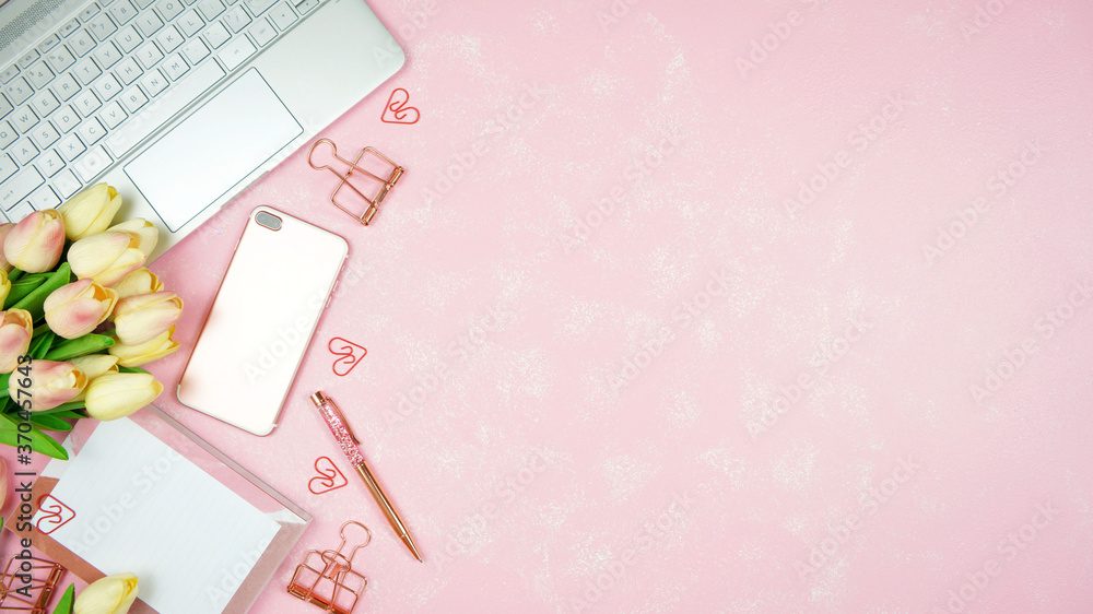 Wall mural feminine pink theme desktop workspace with laptop on stylish textured background. top view blog hero