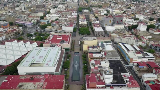 Travelling in over Guadalajara's historic centre and Plaza Tapatia