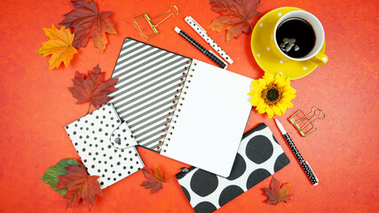 Autumn Fall Halloween Thanksgiving theme desktop workspace with mockups on stylish orange textured background. Top view blog hero header creative composition flat lay.