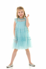 Cute little girl in a light summer dress.