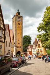 Fototapeta na wymiar Rothenberg, Germany; Clock and bell tower in town wall, Rothenburg ob der Tauber, Germany
