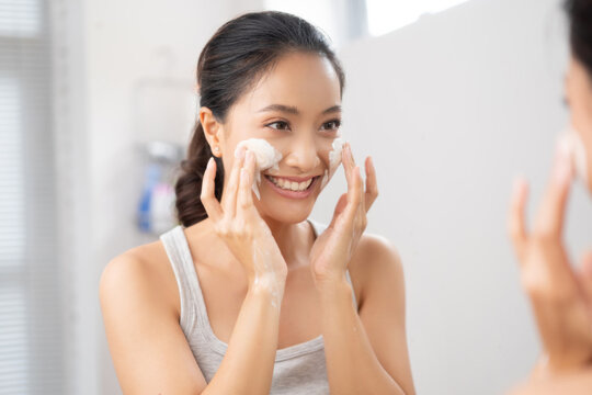 Beautiful female asian Wash face  in bathroom