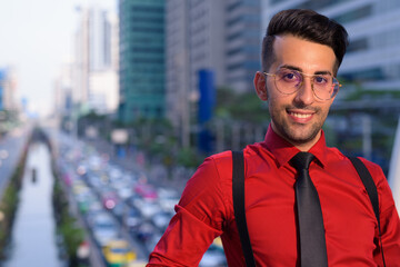 Fototapeta premium Young handsome Persian businessman exploring the city