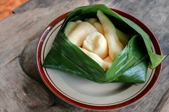 Tapai or Tape or Peuyeum are traditional food snack from indonesia, made from fermented cassava. Served on banana leaf