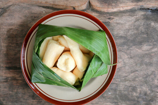 Tapai or Tape or Peuyeum are traditional food snack from indonesia, made from fermented cassava. Served on banana leaf