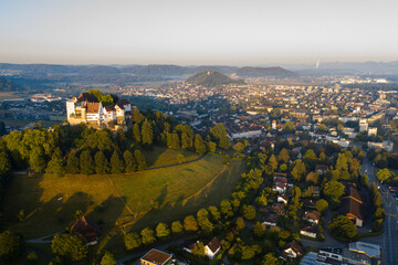 Aerial view of Lenzburg Castle with alpine panorama