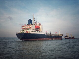 A tanker is anchored at anchorage