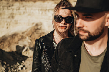 Happy Young Couple Dressed Alike in Black Leather and Jeans Jacket Having Fun Time Outside the City