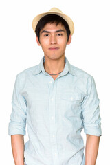 Studio shot of young handsome Asian man wearing hat isolated against white background