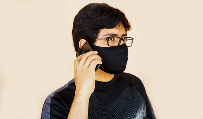 Man with mask receiving a call