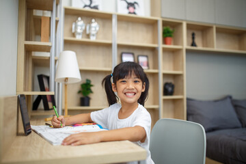 Covid-19 Coronavirus and Learning from home, Home school kid concept. Little children study online...
