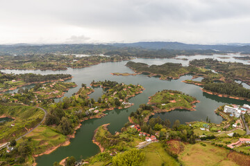 Fototapeta premium image from above of landscape with lake and islands in Embalse Del Peñol