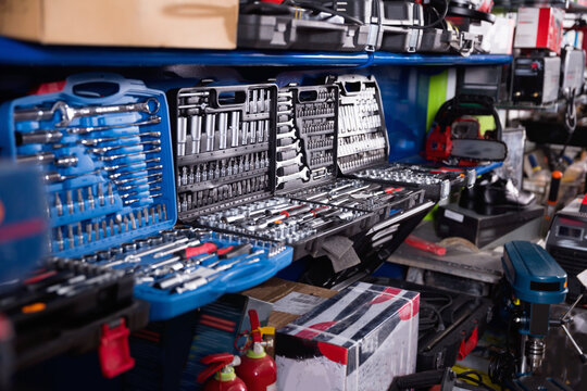 Photo of showcase with construction repair instruments in tools store.