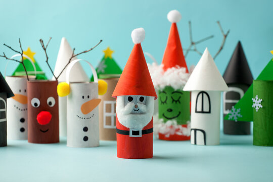 Decoration for Winter season home party - toys made with toilet paper roll. Handicraft snowman, concept of eco-friendly reuse recycle diy creative idea for Christmas and New Year