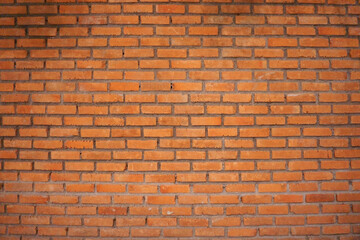 Wall of brown color clay brick in background