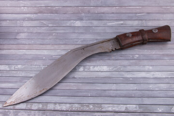 Vintage Ghurkha Khukri Knife on grey wooden background