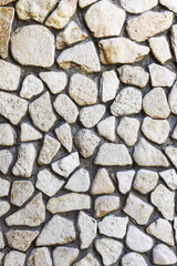 Stone wall background. Background of stone wall of boulders and pebbles