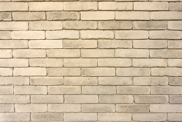 Wall of grey color clay brick in background