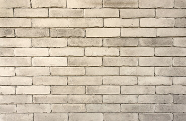 Wall of grey color clay brick texture in background