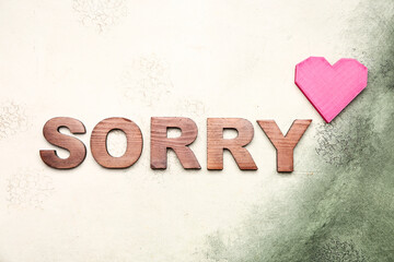 Word SORRY on light background