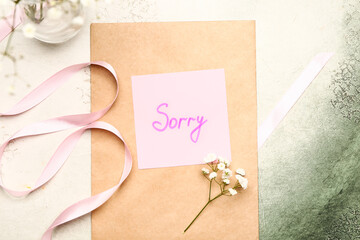 Letter with word SORRY on color background