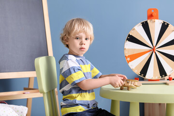 Cute little boy playing in kindergarten
