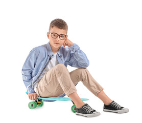 Cute little boy with skateboard on white background © Pixel-Shot