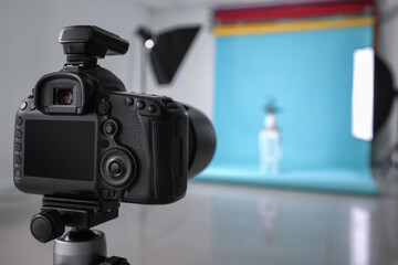 Modern photo camera in studio