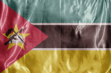 State flag fluttering in the wind. Colored background on textiles